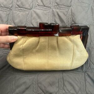 Tan reptile like lucite (I believe) clutch